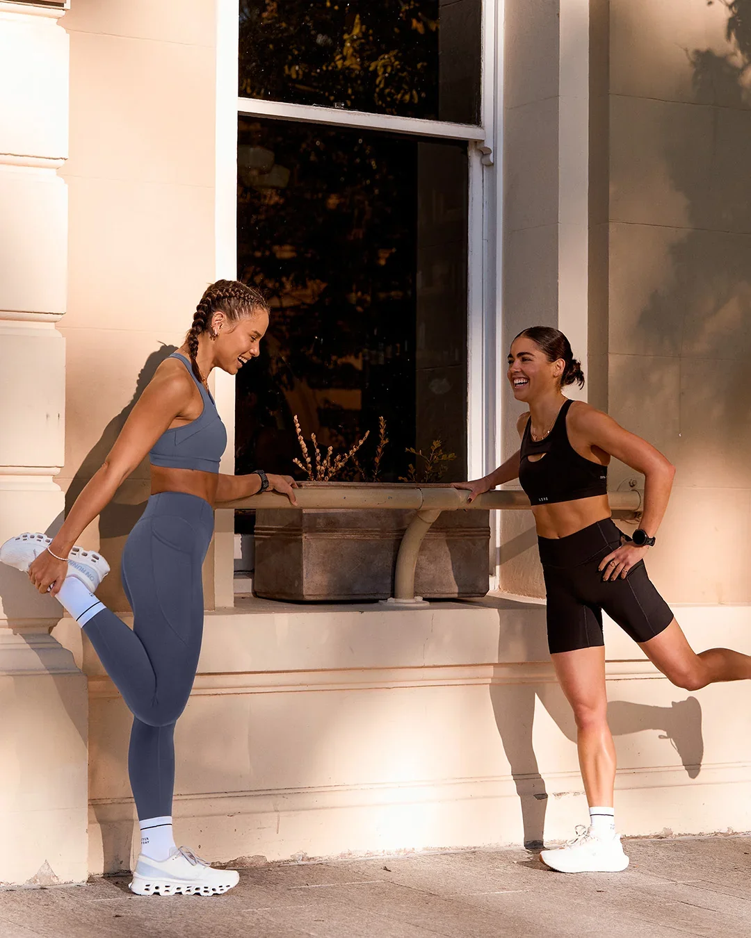 LSKD running campaign photo: two runners stretching before a run